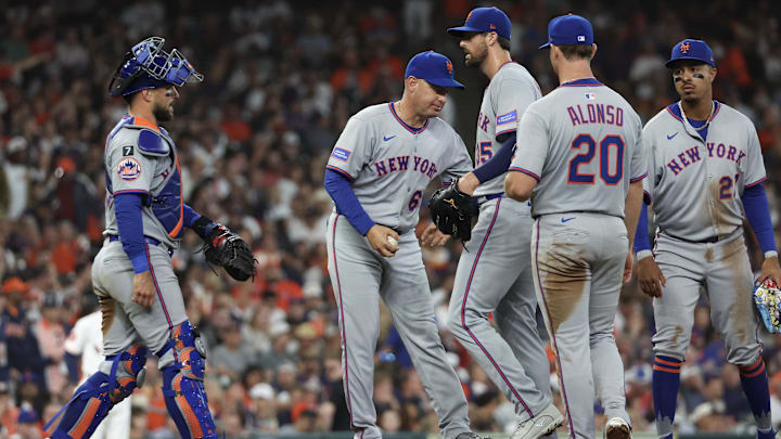 Mar 27, 2025; Houston, Texas, USA; New York Mets manager Carlos Mendoza (64) pulls pitcher Clay Holmes (35) from the game against the Houston Astros in the fifth inning at Daikin Park. Mandatory Credit: Thomas Shea-Imagn Images