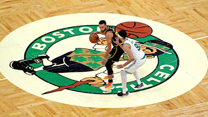 Jun 8, 2022; Boston, Massachusetts, USA; Golden State Warriors guard Stephen Curry (30) brings the ball up court against Boston Celtics guard Derrick White (9) during the second quarter in game three of the 2022 NBA Finals at TD Garden. Mandatory Credit: Paul Rutherford-Imagn Images