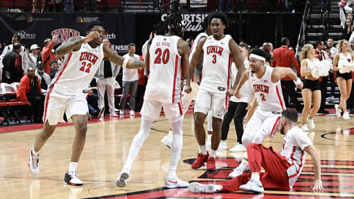 UNLV Rebels forward Karl Jones (22), forward Keylan Boone (20), guard Shane Nowell (3) and guard Justin Webster (2) celebrate the win over San Diego State Aztecs at Thomas & Mack Center. 