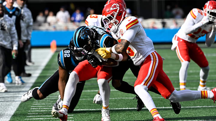 Nov 24, 2024; Charlotte, North Carolina, USA; Carolina Panthers wide receiver Deven Thompkins (13) is tackled by Kansas City Chiefs safety Nazeeh Johnson (13) and Kansas City Chiefs safety Bryan Cook (6) defend in the first quarter at Bank of America Stadium. Mandatory Credit: Bob Donnan-Imagn Images