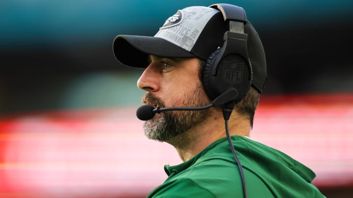 Dec 17, 2023; Miami Gardens, Florida, USA; New York Jets quarterback Aaron Rodgers (8) looks on from the sideline against the Miami Dolphins during the fourth quarter at Hard Rock Stadium. Dec 17, 2023; Miami Gardens, Florida, USA; New York Jets quarterback Aaron Rodgers (8) looks on from the sideline against the Miami Dolphins during the fourth quarter at Hard Rock Stadium.