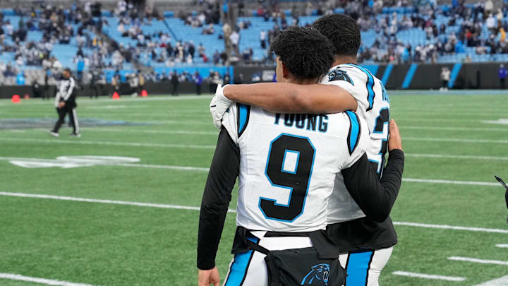 Dec 15, 2024; Charlotte, North Carolina, USA; Carolina Panthers quarterback Bryce Young (9) and running back Chuba Hubbard (30) at the end of the game at Bank of America Stadium. Mandatory Credit: Bob Donnan-Imagn Images