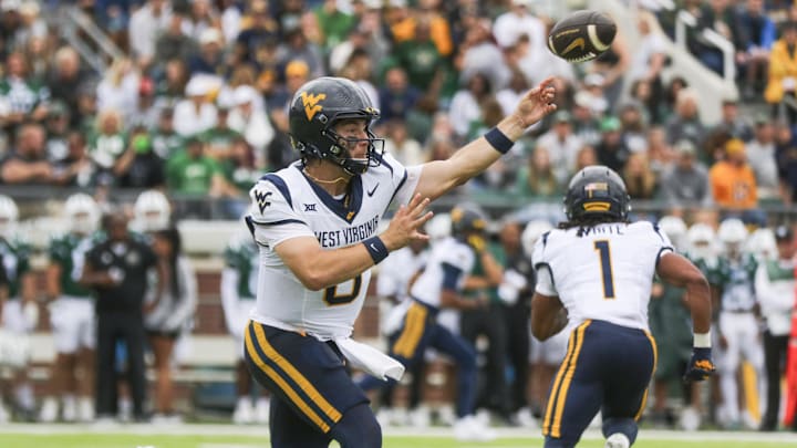 Sep 6, 2025; Athens, Ohio, USA; West Virginia Mountaineers quarterback Nicco Marchiol (8) throws a pass during the first quarter against the Ohio Bobcats at Peden Stadium. Mandatory Credit: Ben Queen-Imagn Images