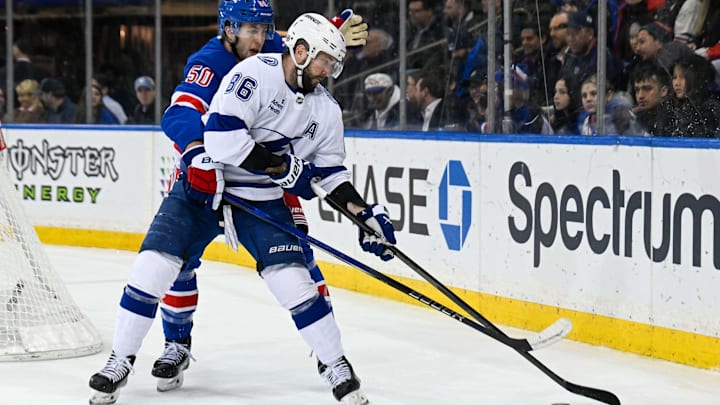 Apr 7, 2025; New York, New York, USA;  New York Rangers left wing Will Cuylle (50) gets called for holding on Tampa Bay Lightning right wing Nikita Kucherov (86) during the third period at Madison Square Garden. Mandatory Credit: Dennis Schneidler-Imagn Images
