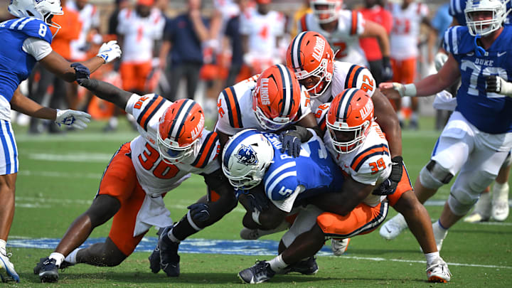 Sep 6, 2025; Durham, North Carolina, USA;  Duke Blue Devils cornerback Kimari Robinson (5) is tackled by Illinois Fighting Illini linebacker Jojo Hayden (30), linebacker Kenenna Odeluga (39), linebacker Ismael Kante (26) and defensive lineman Gentle Hunt (92) during the fourth quarter at Wallace Wade Stadium. Mandatory Credit: Zachary Taft-Imagn Images