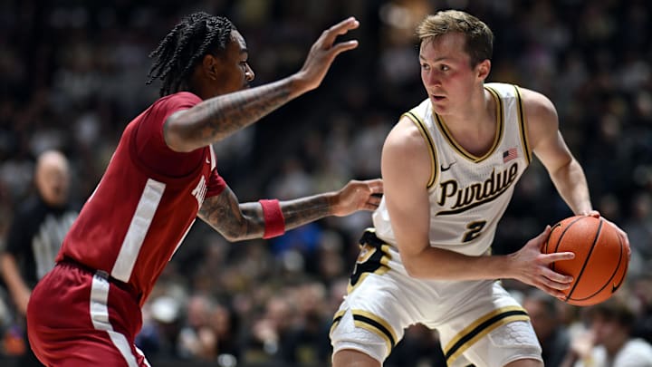 Purdue Boilermakers guard Fletcher Loyer (2) looks to get past Alabama Crimson Tide guard Labaron Philon (0) 
