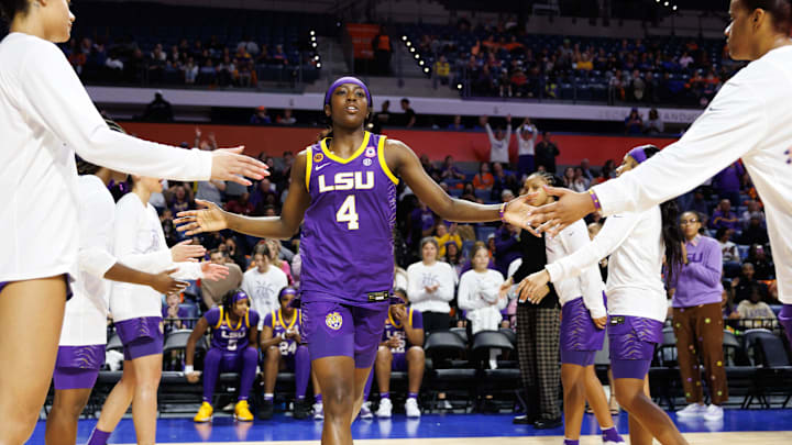 Jan 19, 2025; Gainesville, Florida, USA; LSU Tigers guard Flau'Jae Johnson (4) shakes hands while being introduced before a game against the Florida Gators at Exactech Arena at the Stephen C. O'Connell Center. Mandatory Credit: Matt Pendleton-Imagn Images Jan 19, 2025; Gainesville, Florida, USA; LSU Tigers guard Flau'Jae Johnson (4) shakes hands while being introduced before a game against the Florida Gators at Exactech Arena at the Stephen C. O'Connell Center. Mandatory Credit: Matt Pendleton-Imagn Images