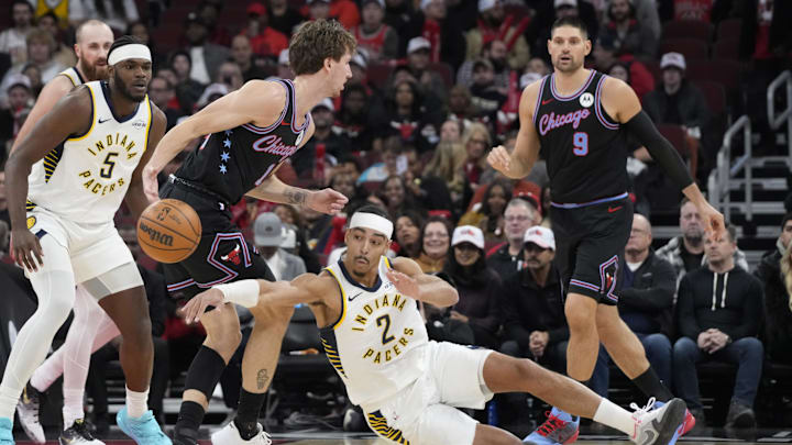 Dec 5, 2025; Chicago, Illinois, USA; Indiana Pacers guard Andrew Nembhard (2) steals the ball from Chicago Bulls forward Matas Buzelis (14) during the first half at United Center. Mandatory Credit: David Banks-Imagn Images