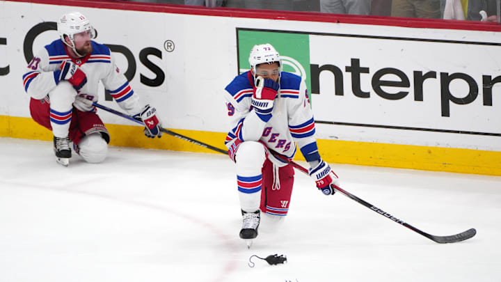 Jun 1, 2024; Sunrise, Florida, USA; New York Rangers center Matt Rempe (73) and New York Rangers left wing Alexis Lafrenière (13) rest on one knee following their loss  against the Florida Panthers in a close-out game six of the Eastern Conference Final of the 2024 Stanley Cup Playoffs at Amerant Bank Arena. Mandatory Credit: Jim Rassol-USA TODAY Sports
