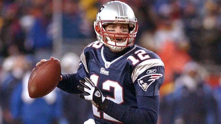 Patriots' quarterback Tom Brady rolls out vs. Tennessee January 10, 2004. Patriots' quarterback Tom Brady rolls out vs. Tennessee January 10, 2004.