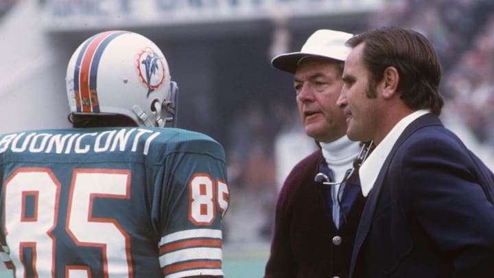 Jan 13, 1974; Houston, TX, USA; FILE PHOTO; Miami Dolphins linebacker Nick Buoniconti (85) talking with assistant coach Bill Arnsparger (white hat) and coach Don Shula (right) against the Minnesota Vikings during Super Bowl VIII at Rice Stadium. Miami defeated Minnesota 24-7.