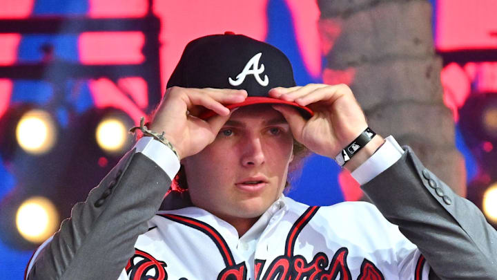 Jul 17, 2022; Los Angeles, CA, USA;  Former Atlanta Braves player Fred McGriff presents JR Ritchie right with his jersey after he was selected by the Atlanta Braves as the 35th pick of the MLB draft at XBox Plaza at LA Live. Mandatory Credit: Jayne Kamin-Oncea-Imagn Images