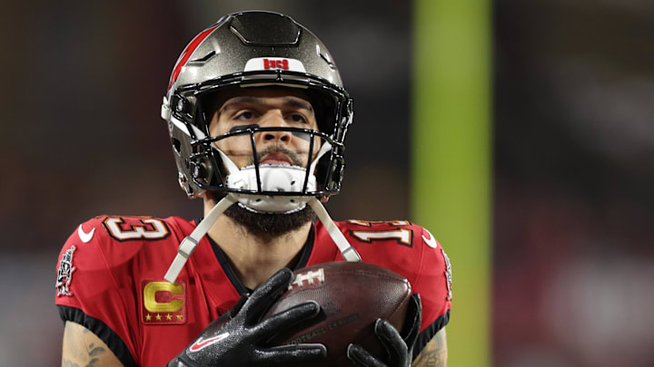 Jan 12, 2025; Tampa, Florida, USA; Tampa Bay Buccaneers wide receiver Mike Evans (13) warms up before a NFC wild card playoff against the Washington Commanders at Raymond James Stadium. Mandatory Credit: Nathan Ray Seebeck-Imagn Images