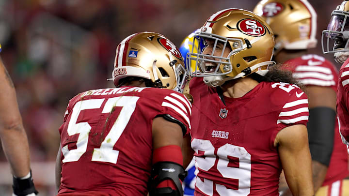 Dec 12, 2024; Santa Clara, California, USA; San Francisco 49ers linebacker Dre Greenlaw (57) is congratulated by safety Talanoa Hufanga (29) after making a tackle against the Los Angeles Rams in the first quarter at Levi's Stadium. Mandatory Credit: Cary Edmondson-Imagn Images