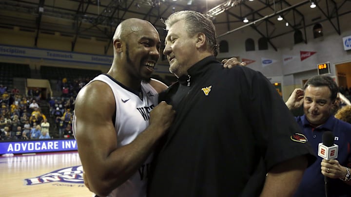 Nov 26, 2017; Kissimmee, FL, USA; West Virginia Mountaineers head coach Bob Huggins and Mountaineers guard Jevon Carter (2) talk after winning the Advocare Invitational against the Missouri Tigers at HP Field House. Mandatory Credit: Kim Klement-Imagn Images