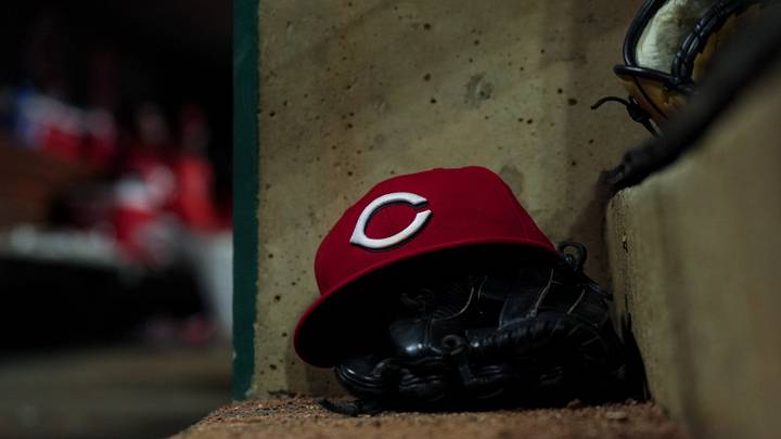 Jun 24, 2026; Cincinnati, Ohio, USA; A Reds on field hat is seen on the dugout steps during the game between the Milwaukee Brewers and the Cincinnati Reds in the eighth inning at Great American Ball Park. Mandatory Credit: Aaron Doster-Imagn Images Jun 24, 2026; Cincinnati, Ohio, USA; A Reds on field hat is seen on the dugout steps during the game between the Milwaukee Brewers and the Cincinnati Reds in the eighth inning at Great American Ball Park. Mandatory Credit: Aaron Doster-Imagn Images