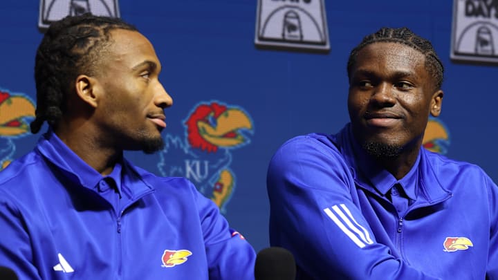 Oct 22, 2025; Kansas City, MO, USA; Kansas guard Darryn Peterson and forward Flory Bidunga react during Big 12 Menís Basketball media day at T-Mobile Center. Mandatory Credit: Sophia Scheller-Imagn Images Oct 22, 2025; Kansas City, MO, USA; Kansas guard Darryn Peterson and forward Flory Bidunga react during Big 12 Menís Basketball media day at T-Mobile Center. Mandatory Credit: Sophia Scheller-Imagn Images
