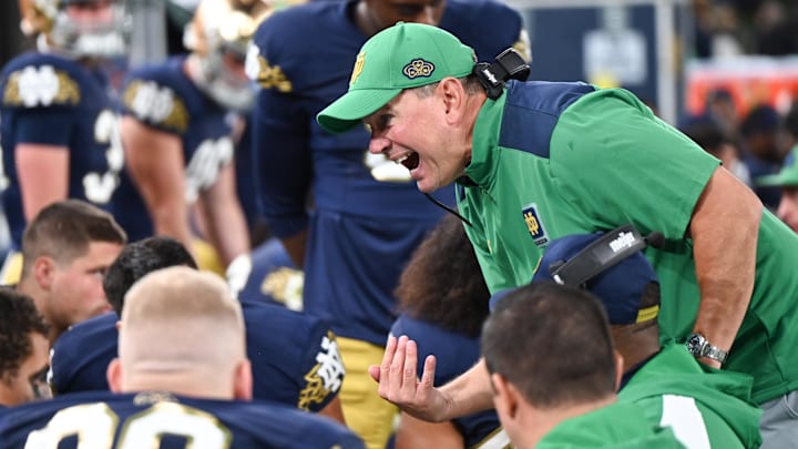 Aug 26, 2023; Dublin, IRL; Notre Dame Fighting Irish Defensive Coordinator Al Golden talks to his players in the second half against the Navy Midshipmen at Aviva Stadium. Mandatory Credit: Matt Cashore-Imagn Images Aug 26, 2023; Dublin, IRL; Notre Dame Fighting Irish Defensive Coordinator Al Golden talks to his players in the second half against the Navy Midshipmen at Aviva Stadium. Mandatory Credit: Matt Cashore-Imagn Images
