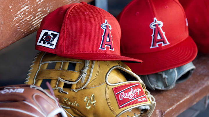 Feb 28, 2025; Phoenix, Arizona, USA; Detailed view of the Los Angeles Angels logo on a hat in the dugout during a spring training game at Camelback Ranch-Glendale. Mandatory Credit: Mark J. Rebilas-Imagn Images Feb 28, 2025; Phoenix, Arizona, USA; Detailed view of the Los Angeles Angels logo on a hat in the dugout during a spring training game at Camelback Ranch-Glendale. Mandatory Credit: Mark J. Rebilas-Imagn Images