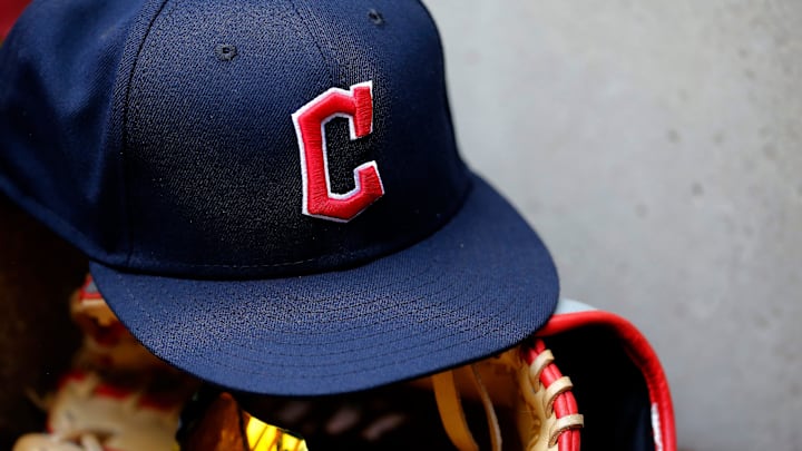 A ball cap sports the Cleveland Guardians logo in the third inning of the MLB Inter-league game between the Cincinnati Reds and the Cleveland Guardians at Great American Ball Park in downtown Cincinnati.