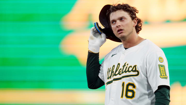 Apr 23, 2025; West Sacramento, California, USA; Athletics first baseman Nick Kurtz (16) takes off his helmet after a play against the Texas Rangers in the second inning at Sutter Health Park. Mandatory Credit: Cary Edmondson-Imagn Images