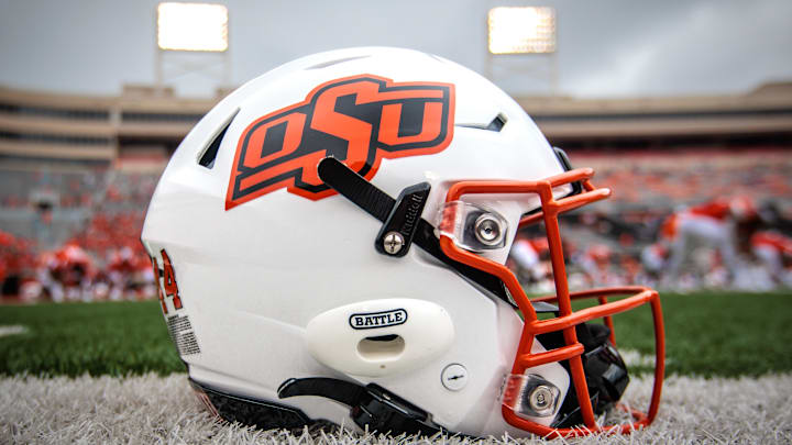 Aug 31, 2024; Stillwater, Oklahoma, USA; Oklahoma State Cowboys helmet sits on the field prior to the game against the South Dakota State Jackrabbits at Boone Pickens Stadium. Mandatory Credit: William Purnell-Imagn Images