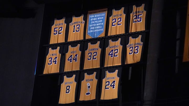 Feb 26, 2021; Los Angeles, California, USA;  The retired Los Angeles Lakers jerseys of Jamaal Wilkes (52), Wilt Chamberlain (13), Elgin Baylor (22), Gail Goodrich (25), Shaquille O'Neal (34), Jerry West (44), Magic Johnson (32), James Worthy (42), Kareem Abdul-Jabbar (33), Chick Hearn and Kobe Bryant (8) and (24)at Staples Center. Mandatory Credit: Kirby Lee-Imagn Images