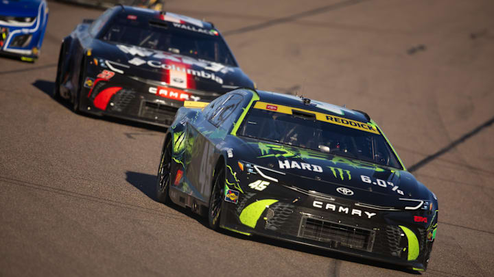 Nov 10, 2024; Avondale, Arizona, USA; NASCAR Cup Series driver Tyler Reddick (45) leads Bubba Wallace (23) during the NASCAR Cup Series Championship race at Phoenix Raceway.