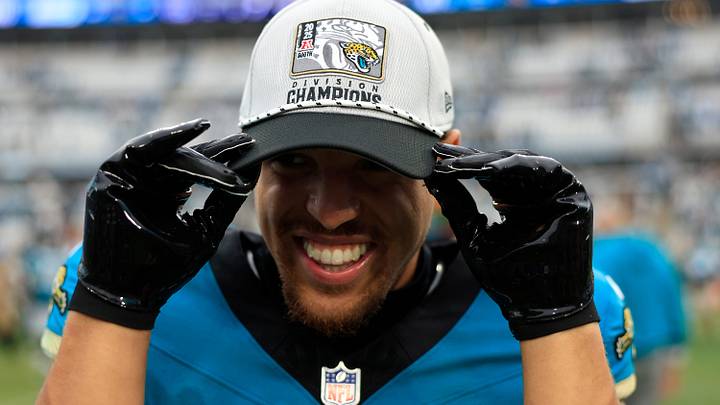 Jacksonville Jaguars wide receiver Parker Washington (11) puts on an AFC South Champions hat after the game of an NFL football matchup at EverBank Stadium, Sunday, Jan. 4, 2026, in Jacksonville, Fla. The Jaguars defeated the Titans 41-7, capturing the AFC North title. [Corey Perrine/Florida Times-Union]