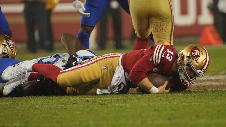 Dec 12, 2024; Santa Clara, California, USA; San Francisco 49ers quarterback Brock Purdy (13) is sacked on the final play against the Los Angeles Rams during the fourth quarter at Levi's Stadium. Mandatory Credit: Kelley L Cox-Imagn Images
