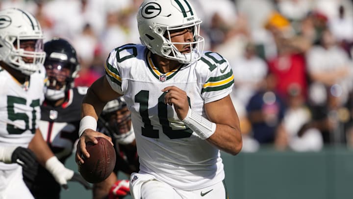 Oct 20, 2024; Green Bay, Wisconsin, USA;  Green Bay Packers quarterback Jordan Love (10) looks to throw a pass during the fourth quarter against the Houston Texans at Lambeau Field. Mandatory Credit: Jeff Hanisch-Imagn Images