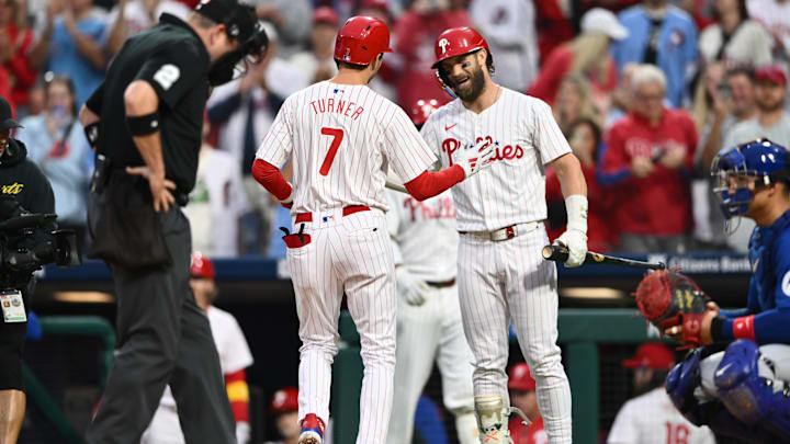 Sep 25, 2024; Philadelphia, Pennsylvania, USA; Philadelphia Phillies shortstop Trea Turner (7) reacts with first baseman Bryce Harper (3) after hitting a home run against the Chicago Cubs in the first inning at Citizens Bank Park. Mandatory Credit: Kyle Ross-Imagn Images