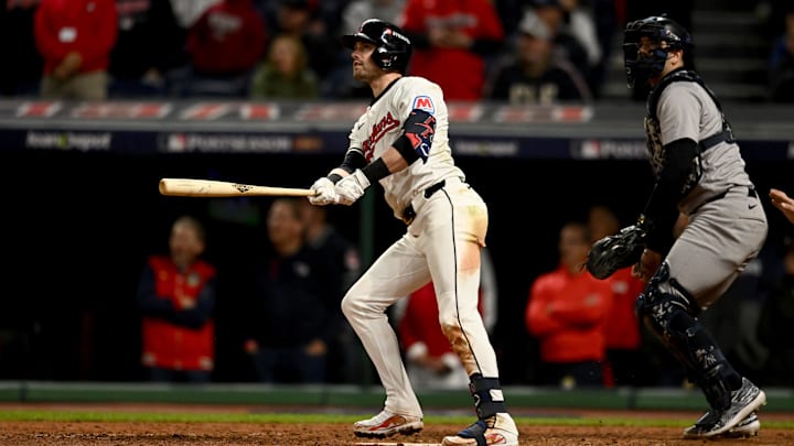 Oct 17, 2024; Cleveland, Ohio, USA; Cleveland Guardians outfielder Lane Thomas (8) doubles during the ninth inning against the New York Yankees in game 3 of the American League Championship Series at Progressive Field. Mandatory Credit: Ken Blaze-Imagn Images