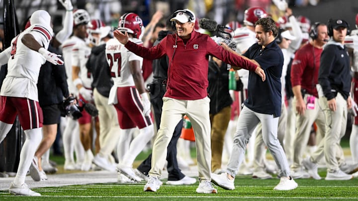 Nov 9, 2024; Nashville, Tennessee, USA; South Carolina Gamecocks head coach Shane Beamer celebrates the win with defensive back Vicari Swain (4) against the Vanderbilt Commodores during the second half at FirstBank Stadium. Mandatory Credit: Steve Roberts-Imagn Images Nov 9, 2024; Nashville, Tennessee, USA; South Carolina Gamecocks head coach Shane Beamer celebrates the win with defensive back Vicari Swain (4) against the Vanderbilt Commodores during the second half at FirstBank Stadium. Mandatory Credit: Steve Roberts-Imagn Images