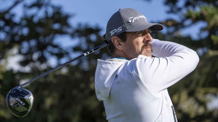 February 2, 2024; Pebble Beach, CA; New York Jets quarterback Aaron Rodgers hits his tee shot on the 16th hole during the second round of the AT&T Pebble Beach Pro-Am golf tournament at Pebble Beach Golf Links. February 2, 2024; Pebble Beach, CA; New York Jets quarterback Aaron Rodgers hits his tee shot on the 16th hole during the second round of the AT&T Pebble Beach Pro-Am golf tournament at Pebble Beach Golf Links.