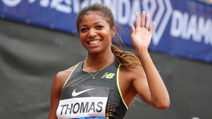 Gabby Thomas poses after winning the women's 200m in a meet record 21.82.