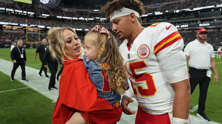 Kansas City Chiefs quarterback Patrick Mahomes (15) interacts with wife Brittany Mahomes and daughter Sterling Mahomes during the game against the Las Vegas Raiders.