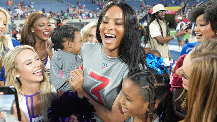 Recording artist Ciara with daughters Sienna Wilson and Amora Wilson pose with cheerleaders during the 2025 Pro Bowl Games at Camping World Stadium. 
