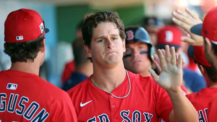 Boston Red Sox outfielder Roman Anthony (48) is congratulated after he scored a run against the Philadelphia Phillies during the third inning at BayCare Ballpark. Boston Red Sox outfielder Roman Anthony (48) is congratulated after he scored a run against the Philadelphia Phillies during the third inning at BayCare Ballpark.