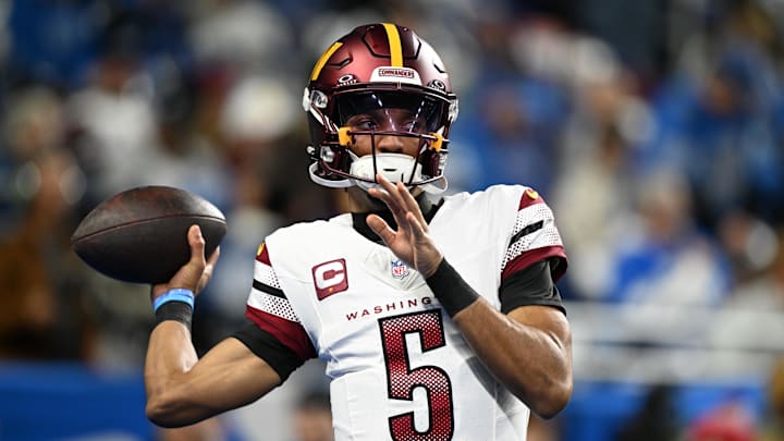 Jan 18, 2025; Detroit, Michigan, USA; Washington Commanders quarterback Jayden Daniels (5) warms up prior to the game against Detroit Lions in a 2025 NFC divisional round game at Ford Field. Mandatory Credit: Lon Horwedel-Imagn Images