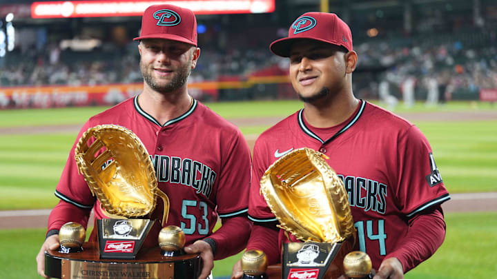 Mar 31, 2024; Phoenix, Arizona, USA; Arizona Diamondbacks first baseman Christian Walker (53) and Arizona Diamondbacks catcher Gabriel Moreno (14) receive their Gold Glove Awards prior to the game against the Colorado Rockies at Chase Field. Mandatory Credit: Joe Camporeale-Imagn Images