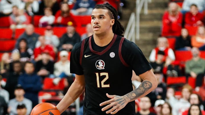 Dec 7, 2024; Raleigh, North Carolina, USA; Florida State Seminoles forward Malique Ewin (12) controls the ball against the North Carolina State Wolfpack during the second half at Lenovo Center. Mandatory Credit: Jaylynn Nash-Imagn Images Dec 7, 2024; Raleigh, North Carolina, USA; Florida State Seminoles forward Malique Ewin (12) controls the ball against the North Carolina State Wolfpack during the second half at Lenovo Center. Mandatory Credit: Jaylynn Nash-Imagn Images