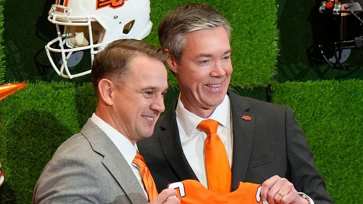 OSU Athletic Director Chad Weiberg presents a jersey to Eric Morris. OSU Athletic Director Chad Weiberg presents a jersey to Eric Morris.
