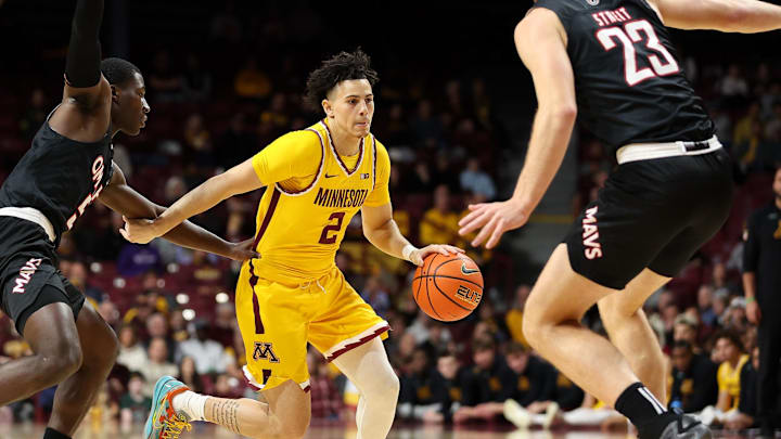 Nov 9, 2024; Minneapolis, Minnesota, USA; Minnesota Golden Gophers guard Mike Mitchell Jr. (2) works up court as Omaha Mavericks guard Ja'Sean Glover (5) defends during the first half at Williams Arena. Mandatory Credit: Matt Krohn-Imagn Images