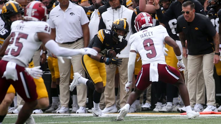 Iowa’s Jacob Gill (5) runs for extra yards after a catch against Troy Saturday, Sept. 14, 2024 at Kinnick Stadium in Iowa City, Iowa.