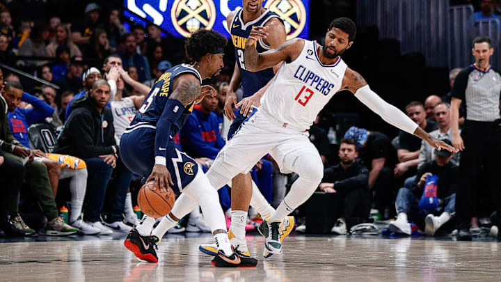 Jan 5, 2023; Denver, Colorado, USA; Los Angeles Clippers guard Paul George (13) gets tripped up with forward Zeke Nnaji (22) as he defends guard Kentavious Caldwell-Pope (5) in the second quarter at Ball Arena. Mandatory Credit: Isaiah J. Downing-Imagn Images
