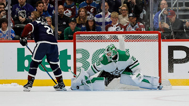 Oct 11, 2025; Denver, Colorado, USA; Dallas Stars goaltender Jake Oettinger (29) makes a shootout save against Colorado Avalanche center Nathan MacKinnon (29) to win the game at Ball Arena. Mandatory Credit: Isaiah J. Downing-Imagn Images