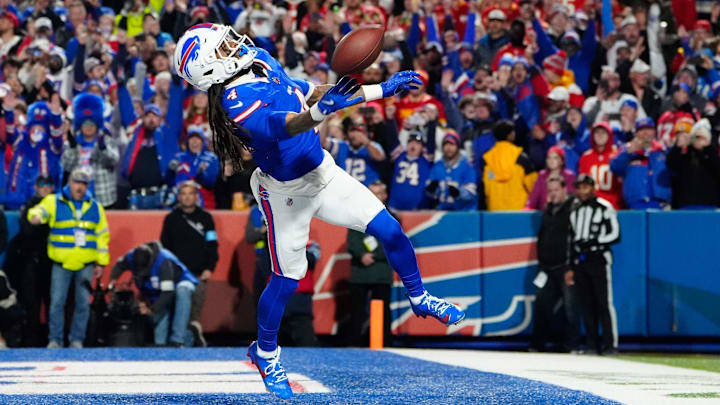 Nov 17, 2024; Orchard Park, New York, USA; Buffalo Bills running back James Cook (4) throws the ball into the stands to celebrate scoring a touchdown against the Kansas City Chiefs during the first half at Highmark StadiumImages