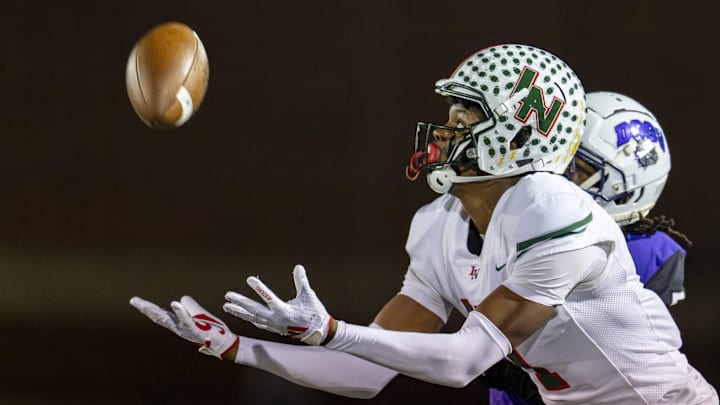 Lawrence North High School sophomore Monshun Sales (1) makes a reception for a 38-yard gain during the first half of an IHSAA Class 6A Regional Championship game against Brownsburg High School, Friday, Nov. 15, 2024, at Brownsburg High School.