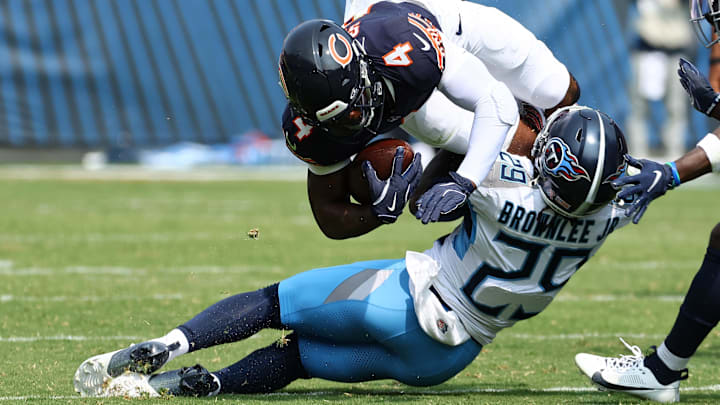 Sep 8, 2024; Chicago, Illinois, USA; Tennessee Titans cornerback Jarvis Brownlee Jr. (29) makes a tackle on Chicago Bears running back D'Andre Swift (4) during the second quarter at Soldier Field. Mandatory Credit: Mike Dinovo-Imagn Images Sep 8, 2024; Chicago, Illinois, USA; Tennessee Titans cornerback Jarvis Brownlee Jr. (29) makes a tackle on Chicago Bears running back D'Andre Swift (4) during the second quarter at Soldier Field. Mandatory Credit: Mike Dinovo-Imagn Images